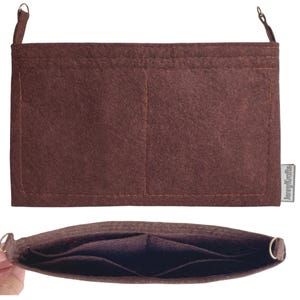 May include: A brown felt handbag organizer with multiple pockets and a rectangular shape. The organizer has two small metal rings at the top for attaching a strap. The brand name "JennyKrafts" is printed on a small tag.