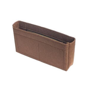 May include: Brown felt bag organizer with a zippered pocket and two open compartments.