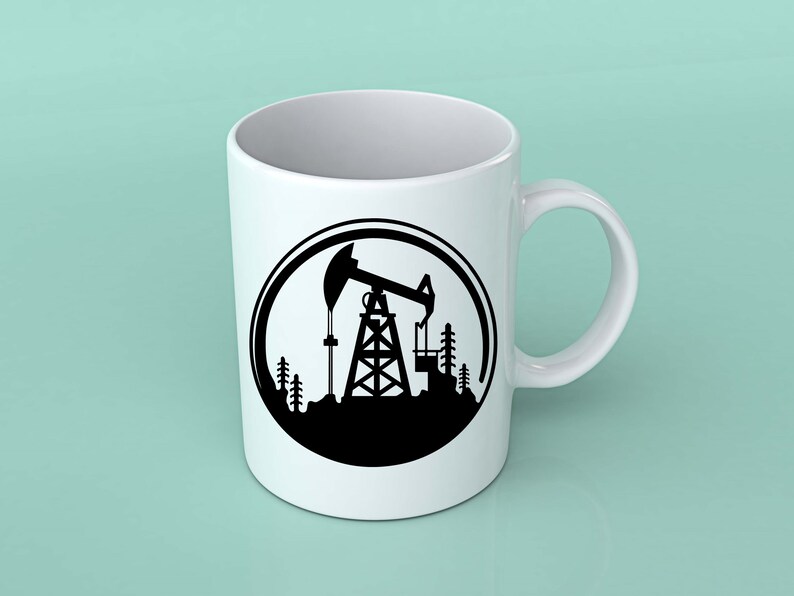 May include: White ceramic mug with a black silhouette of an oil rig in a circle design. The oil rig is surrounded by trees.