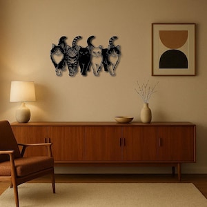 May include: A wooden wall art piece featuring five stylized cat silhouettes in black. The cats have varying patterns and poses, creating a playful and decorative element. The artwork is mounted on a neutral-colored wall.