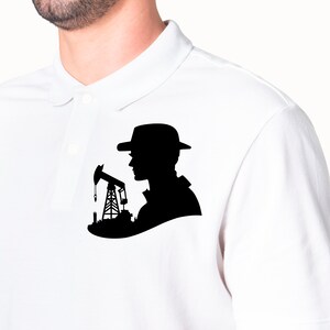 May include: A white polo shirt with a black silhouette of a person wearing a hat and standing next to an oil derrick.