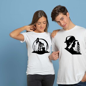 May include: Two white t-shirts with black graphic designs. One shirt features a silhouette of an oil rig with a pump jack. The other shirt features a silhouette of a person wearing a hat and looking at an oil rig.
