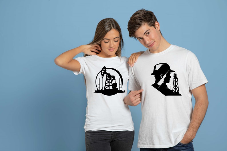 May include: Two white t-shirts with black graphic designs. One shirt features a silhouette of an oil rig with a pump jack. The other shirt features a silhouette of a person wearing a hat and looking at an oil rig.
