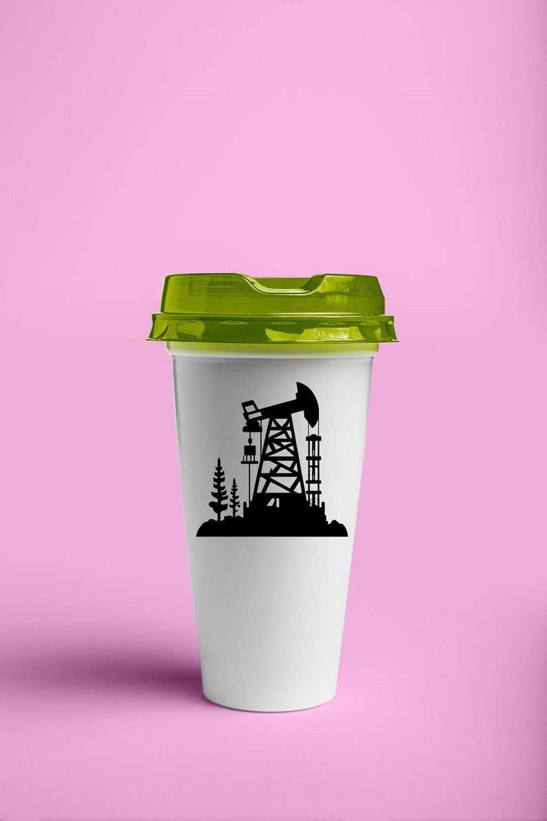 May include: A white to-go coffee cup with a green lid. The cup has a black silhouette of an oil rig and trees on the side.