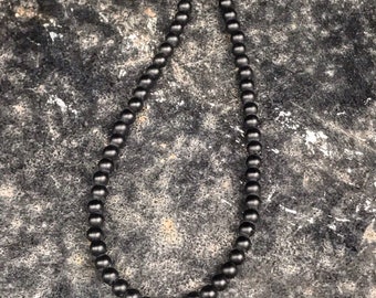 Pave diamond skull necklace
