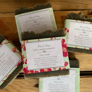 May include: Four bars of green soap with white labels that read "B & G Honey Nettle Herbal Shampoo Bar Oily Hair" with a list of ingredients including palm oil, coconut oil, olive oil, caster oil, hazelnut oil, nettle, sodium hydroxide, lemon, orange, eucalyptus & neroli essential oil 4oz.