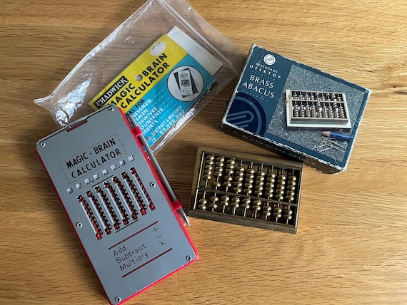 Vintage Magic Brain Calculator And Solid Brass Desktop Abacus.