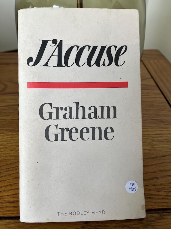 J’Accuse By Graham Greene Rare 1st Edition Soft cover Book 1982 Text In English And In French.