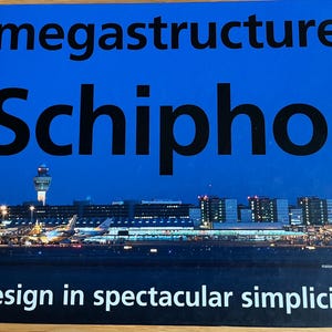 May include: A book titled "megastructure Schiphol" with a blue cover. The cover features a nighttime photograph of an airport with the text "design in spectacular simplicity". The book is published by nai010 publishers.