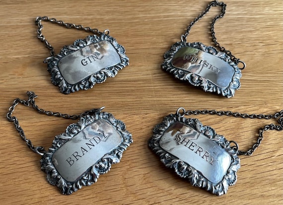Vintage set Of 4 Engraved Decanter Bottle Tags On Chains, Makers Mark In Reverse.