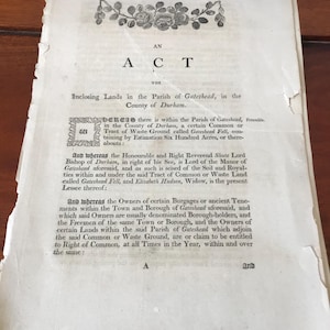 May include: A black and white text document with the title "An Act for Inclosing Lands in the Parish of Gateshead, in the County of Durham."