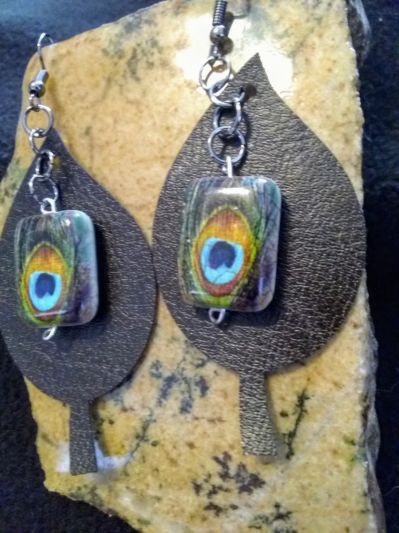 Peacock feathers bead over Black faux Leather Leaf Earrings