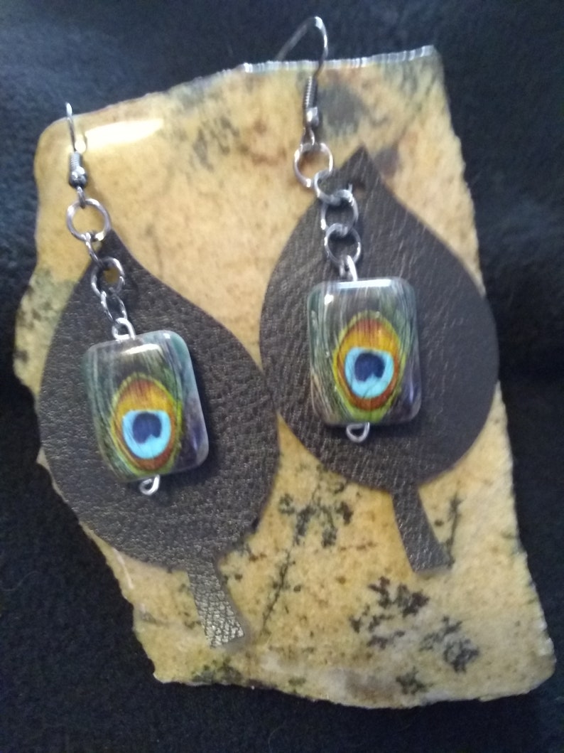 Peacock feathers bead over Black faux Leather Leaf Earrings