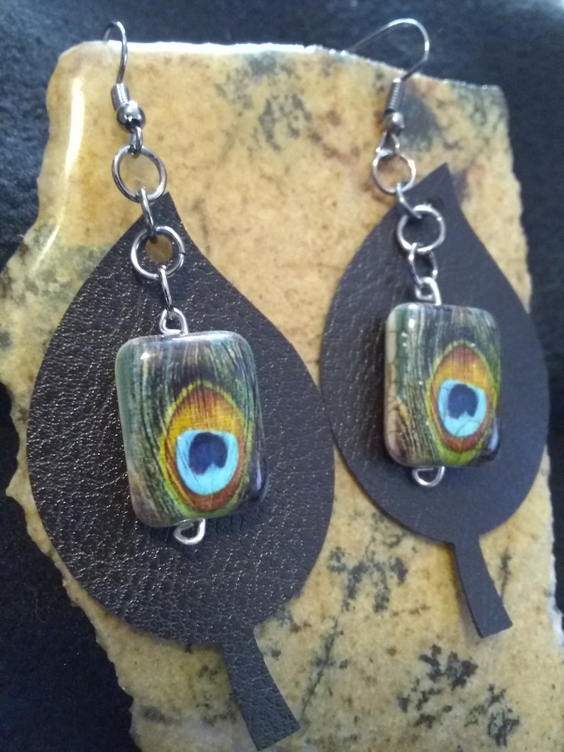 Peacock feathers bead over Black faux Leather Leaf Earrings