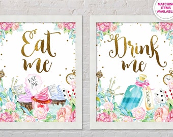 May include: Two printable Alice in Wonderland themed signs with gold lettering. The first sign says "Eat Me" and features cupcakes with "Eat Me" flags. The second sign says "Drink Me" and features a blue bottle with a pink ribbon and a "Drink Me" label.