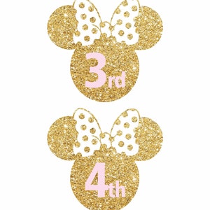 May include: Two gold glitter Minnie Mouse ears with white polka dot bows. The ears have pink numbers on them, one says "3rd" and the other says "4th".