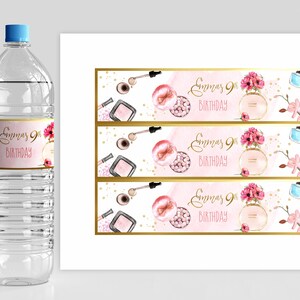 May include: Three pink and gold water bottle labels with a watercolor design of makeup and flowers. The text on the labels reads "Emma's 9th Birthday".