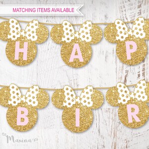 May include: Gold glitter Minnie Mouse ears with pink polka dots and pink letters spelling out "Happy Birthday".
