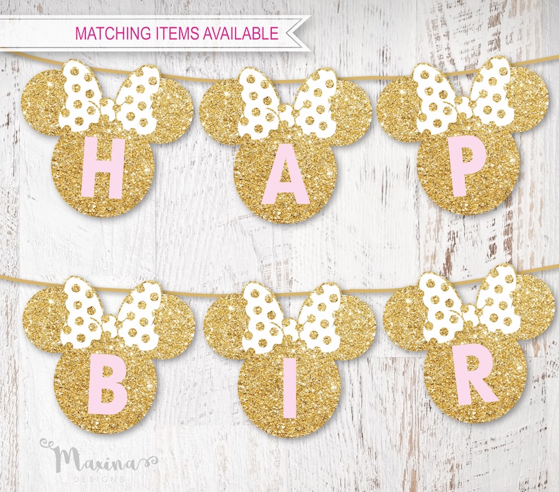May include: Gold glitter Minnie Mouse ears with pink polka dots and pink letters spelling out "Happy Birthday".