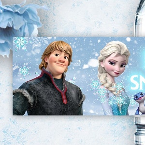 May include: A blue and white banner featuring a cartoon image of Elsa and Kristoff from the film Frozen. The banner has a blue background with white snowflakes and the text "Let It Snow".