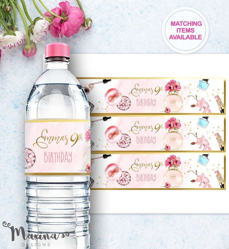 May include: Water bottle label with a pink and gold design featuring makeup and flowers. The text on the label reads "Emmas 9th Birthday".