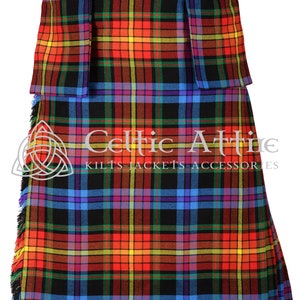 May include: A traditional kilt with a colorful tartan pattern in shades of red, yellow, blue, green, and purple. The kilt has a black base and features a fringe at the bottom. The text "Celtic Attire Kilts - Jackets - Accessories" is visible at the bottom of the image.