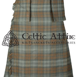 May include: A traditional kilt with a brown and green plaid pattern. The kilt has a fringed bottom and is made of a woven fabric. The kilt is a traditional garment worn by men in Scotland.