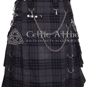 May include: A grey and black tartan kilt with a silver chain and metal accents. The kilt features a Celtic knot design and the text "Celtic Attire Kilts-Jackets-Accessories".