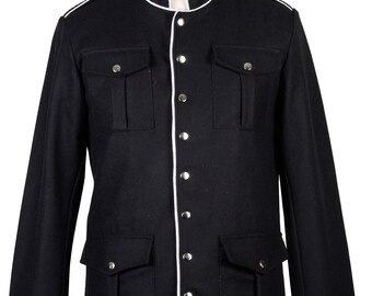May include: A black jacket with a white trim around the collar, cuffs, and front. The jacket has a mandarin collar, a button-up front, and two large flap pockets on the front.