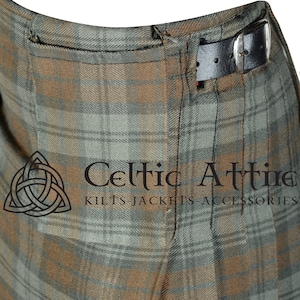 May include: Close-up of a brown and green kilt with a black leather belt. The kilt has a pocket on the side and is made of a plaid fabric. The text "Celtic Attire Kilts Jackets Accessories" is visible at the bottom of the image.