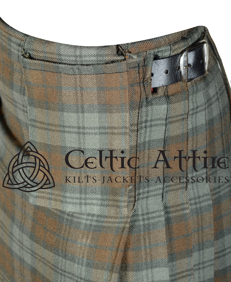 May include: Close-up of a brown and green kilt with a black leather belt. The kilt has a pocket on the side and is made of a plaid fabric. The text "Celtic Attire Kilts Jackets Accessories" is visible at the bottom of the image.