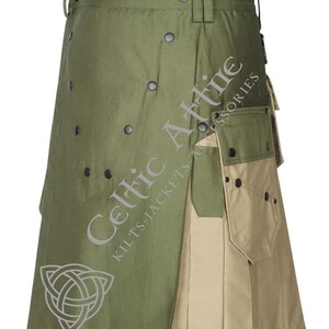 Op de afbeelding: Een groene en bruine utility kilt met meerdere zakken en een Keltisch knoopontwerp. De kilt heeft een gespsluiting en is gemaakt van een duurzame stof.