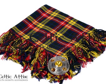 May include: A red, yellow, and blue tartan kilt pin with a silver and gold metal kilt pin. The kilt pin is on a white background.
