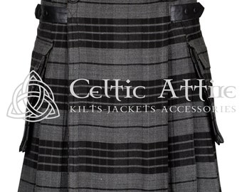 May include: A grey and black striped kilt with cargo pockets and leather straps. The kilt has a Celtic Attire logo on the front.