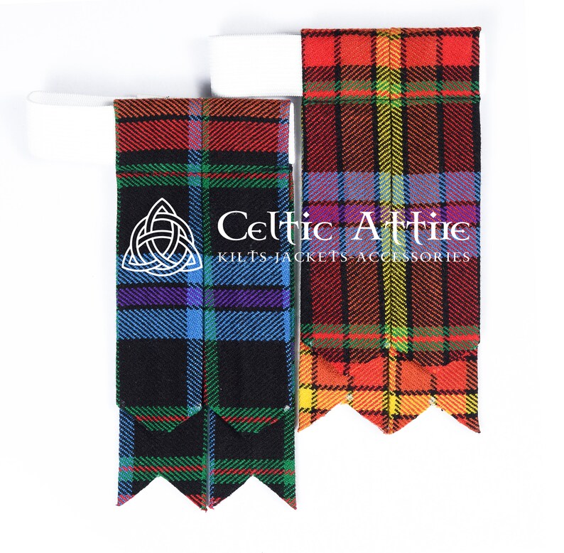 May include: Two pairs of kilt hose with a black background and colorful plaid patterns. The hose are made of a woven fabric and have a traditional Scottish design. The hose are displayed on a white background with the text "Celtic Attire Kilts Jackets Accessories" printed on the right side of the image.