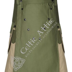 Op de afbeelding: Een groene en bruine utility kilt met meerdere zakken en zwarte knoopaccenten. De kilt heeft de tekst "Celtic Attire Kilts-Jackets-Accessories" op de voorkant.