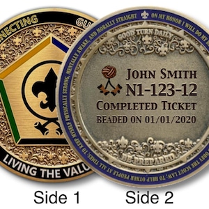 May include: Two-sided gold and silver coin with detailed engravings. Side 1 features a gold emblem with a black border and text that reads "CONNECTING, GROWING, LIVING THE VALUE." Side 2 has text: "John Smith, N1-123-12, COMPLETED TICKET, BEADED ON 01/01/2020."