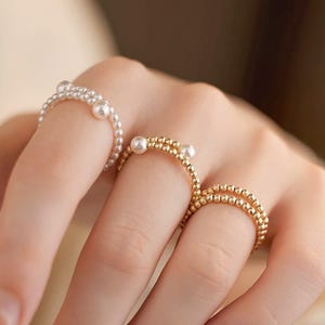 Elastisk rund pärlsträckring: Lätt att bära guldpärlöppning, brudsmycken
