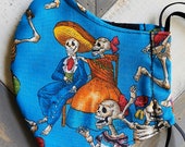 Double layer. Dancing Calacas Día de Los Muertos, Turquoise Sugar Skull Reusable, Washable Face Mask