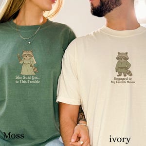 Medieval raccoon bride illustration with whimsical engagement phrase.