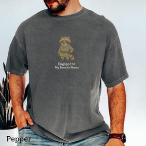 Snarky engagement shirt featuring medieval raccoon character