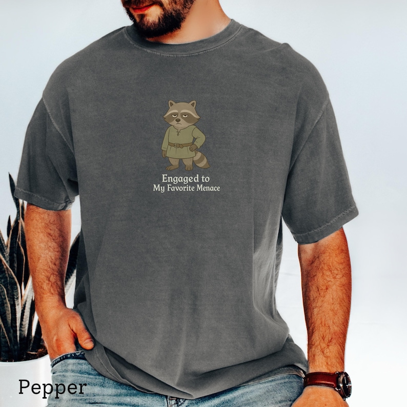 Snarky engagement shirt featuring medieval raccoon character