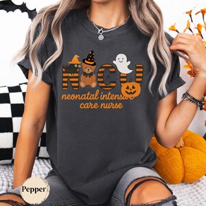 Comfort Colors Style Halloween NICU Nurse Shirt with Ghost and Pumpkin Design.