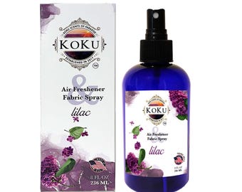 May include: A blue bottle of lilac scented air freshener and fabric spray with a white label. The label has the text "KOKU" and "Air Freshener & Fabric Spray lilac" on it. The bottle is 8 fluid ounces or 236 milliliters.