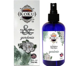 May include: A blue bottle of gardenia scented air freshener and fabric spray. The bottle is labeled "KOKU Air Freshener & Fabric Spray gardenia" and has a white and green floral design. The bottle is 8 fluid ounces or 236 milliliters.