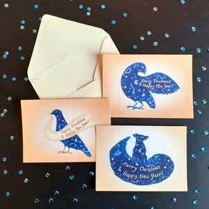 set kerstkaarten met envelop, nieuwjaars wensen, illustratie postkaarten met sterrenhemel, poolvos, vogels, kerstwensen