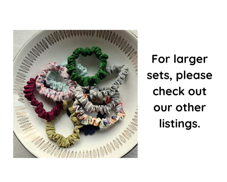 May include: A collection of fabric hair scrunchies in various colors including green, maroon, olive, grey, and floral patterns, arranged inside a white bowl with a leaf pattern. The text reads: For larger sets, please check out our other listings.