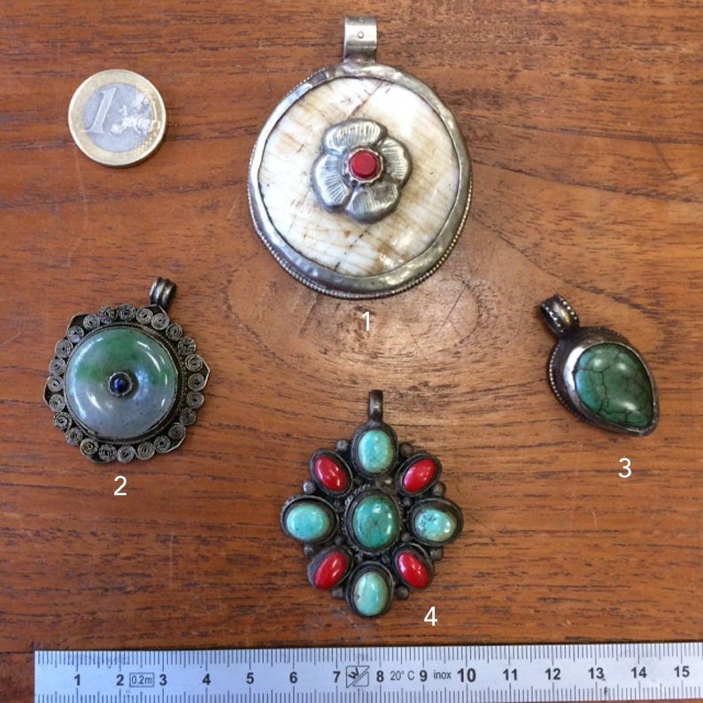 Very nice quality finish silver tone craft and traditional genuine semi precious stone! Selection of the Nepal pendants