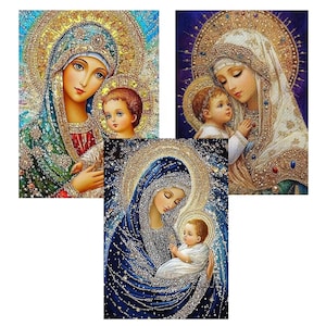 May include: Three religious art prints featuring the Virgin Mary and baby Jesus. The artwork showcases detailed depictions with halos, intricate clothing, and a sparkling, jewel-like effect. The color palette includes blues, golds, and whites.