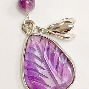 Carved amethyst leaf and flower pendant